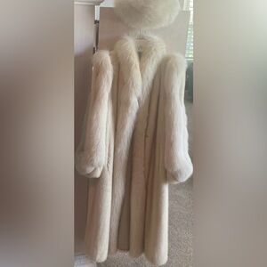 Full length ivory mink coat with fox trim and fox hat